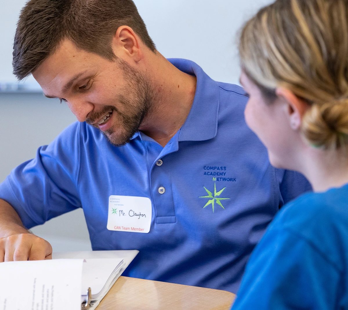 Clayton Carnahan helping a student